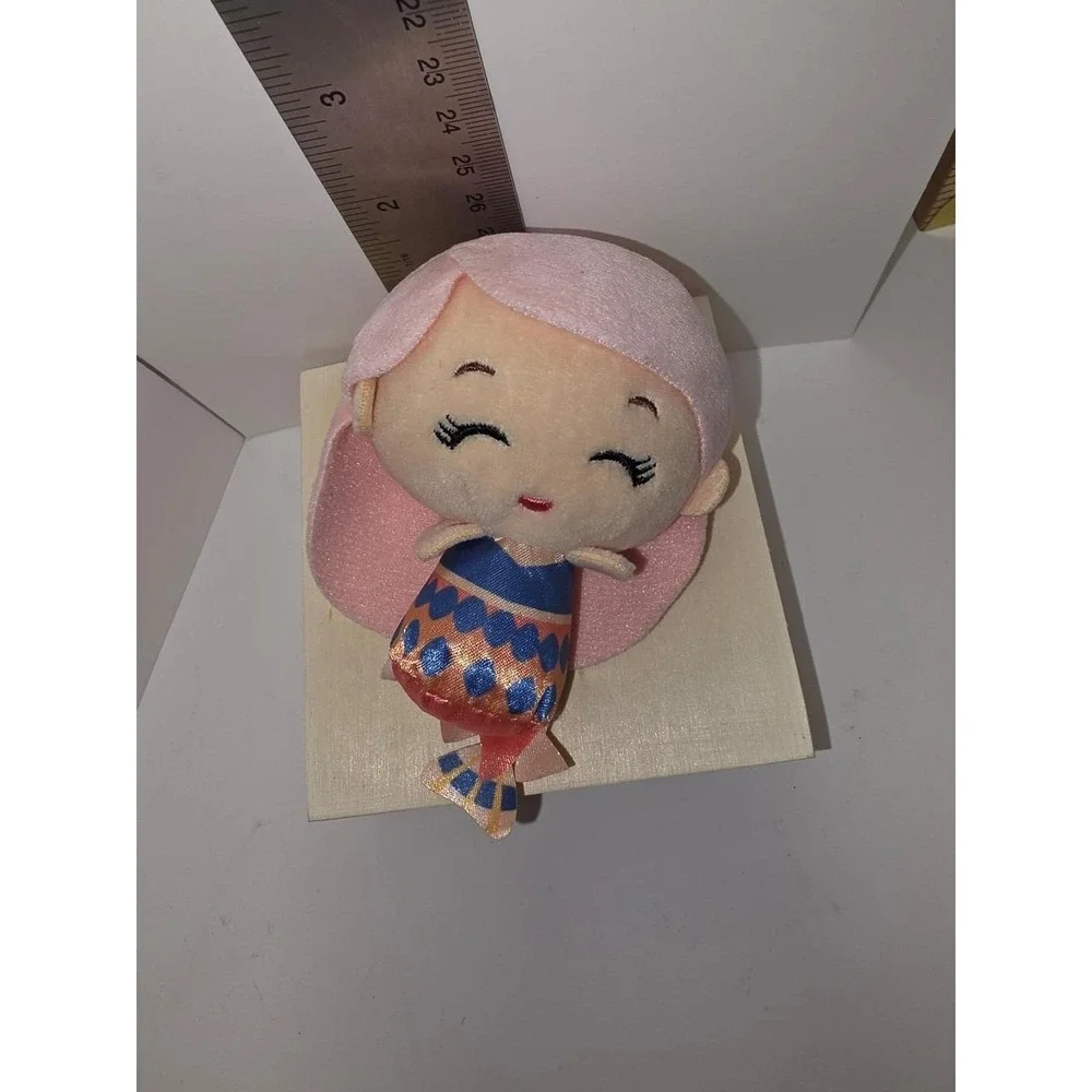 Disney Little Mermaid Caspia mini plush features a soft, light pink hairstyle